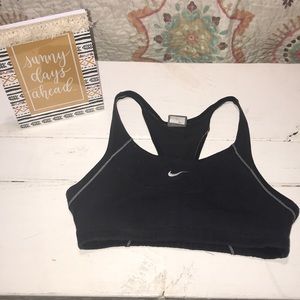 Woman’s black Nike sports bra